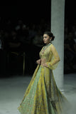 A VIBRANT PLAY OF YELLOW AND MINT, BROUGHT TO LIFE THROUGH INTRICATE EMBROIDERY. (3 PCS)