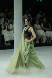 PISTACHIO GREEN EMB LEHENGA SAREE PAIRED WITH A BLACK FLORAL EMB BLOUSE AND EMBELLISHED JACKET.(4 PCS)