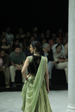 PISTACHIO GREEN EMB LEHENGA SAREE PAIRED WITH A BLACK FLORAL EMB BLOUSE AND EMBELLISHED JACKET.(4 PCS)