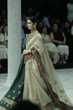 TOOSH TISSUE SAREE PAIRED WITH A GREEN DUPION EMBROIDERED LEHENGA AND MUSTARD EMBROIDERED JACKET. (4 PCS)