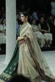 TOOSH TISSUE SAREE PAIRED WITH A GREEN DUPION EMBROIDERED LEHENGA AND MUSTARD EMBROIDERED JACKET. (4 PCS)