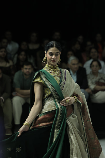 TOOSH TISSUE SAREE PAIRED WITH A GREEN DUPION EMBROIDERED LEHENGA AND MUSTARD EMBROIDERED JACKET. (4 PCS)