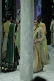 DARK GOLD CRINKLE TISSUE EMBROIDERED SAREE PAIRED WITH A NUDE BUSTIER, GOLD KOTA TISSUE SCALLOP EMBROIDERED JACKET, AND GREEN VELVET EMBROIDERED KOTI. (5 PCS)