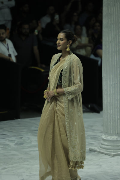 DARK GOLD CRINKLE TISSUE EMBROIDERED SAREE PAIRED WITH A NUDE BUSTIER, GOLD KOTA TISSUE SCALLOP EMBROIDERED JACKET, AND GREEN VELVET EMBROIDERED KOTI. (5 PCS)