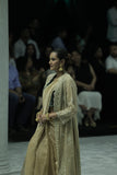DARK GOLD CRINKLE TISSUE EMBROIDERED SAREE PAIRED WITH A NUDE BUSTIER, GOLD KOTA TISSUE SCALLOP EMBROIDERED JACKET, AND GREEN VELVET EMBROIDERED KOTI. (5 PCS)