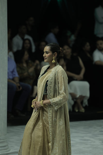 DARK GOLD CRINKLE TISSUE EMBROIDERED SAREE PAIRED WITH A NUDE BUSTIER, GOLD KOTA TISSUE SCALLOP EMBROIDERED JACKET, AND GREEN VELVET EMBROIDERED KOTI. (5 PCS)
