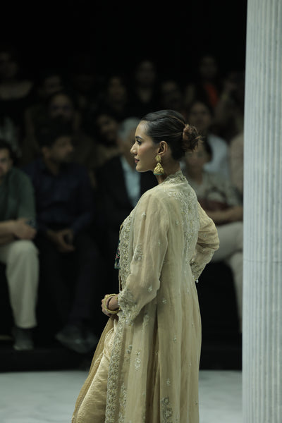 DARK GOLD CRINKLE TISSUE EMBROIDERED SAREE PAIRED WITH A NUDE BUSTIER, GOLD KOTA TISSUE SCALLOP EMBROIDERED JACKET, AND GREEN VELVET EMBROIDERED KOTI. (5 PCS)