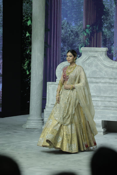 CHAMPAGNE GOLD EMBROIDERED LEHENGA PAIRED WITH A CRIMSON EMBROIDERED BLOUSE AND DUAL EMBELLISHED DUPATTAS. (4 PCS)