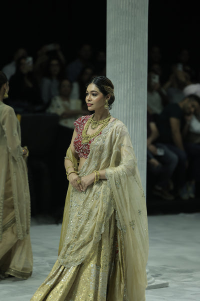 CHAMPAGNE GOLD EMBROIDERED LEHENGA PAIRED WITH A CRIMSON EMBROIDERED BLOUSE AND DUAL EMBELLISHED DUPATTAS. (4 PCS)