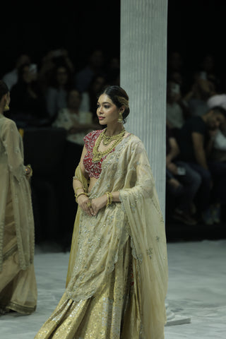 CHAMPAGNE GOLD EMBROIDERED LEHENGA PAIRED WITH A CRIMSON EMBROIDERED BLOUSE AND DUAL EMBELLISHED DUPATTAS. (4 PCS)