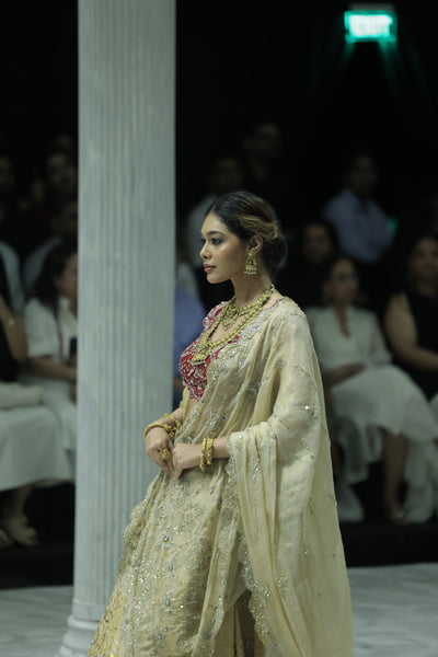 CHAMPAGNE GOLD EMBROIDERED LEHENGA PAIRED WITH A CRIMSON EMBROIDERED BLOUSE AND DUAL EMBELLISHED DUPATTAS. (4 PCS)