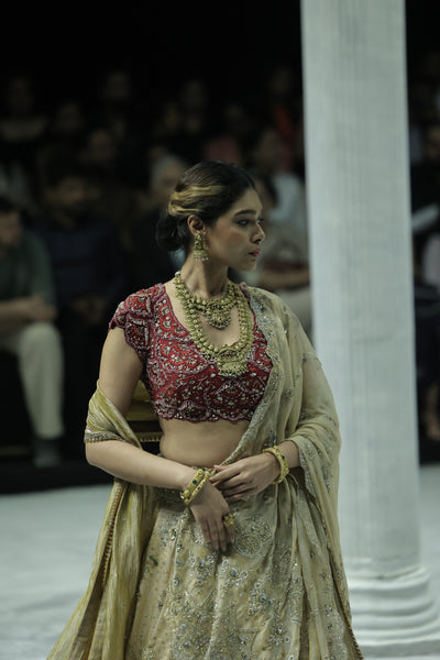 CHAMPAGNE GOLD EMBROIDERED LEHENGA PAIRED WITH A CRIMSON EMBROIDERED BLOUSE AND DUAL EMBELLISHED DUPATTAS. (4 PCS)