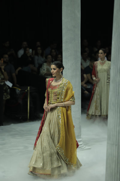 TISSUE EMBROIDERED LEHENGA PAIRED WITH AN EMBROIDERED BLOUSE, EMBELLISHED KOTI, AND DUAL DUPATTAS IN YELLOW TULLE AND RED EMBROIDERY.(5 PCS)
