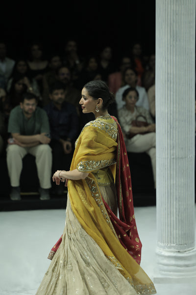 TISSUE EMBROIDERED LEHENGA PAIRED WITH AN EMBROIDERED BLOUSE, EMBELLISHED KOTI, AND DUAL DUPATTAS IN YELLOW TULLE AND RED EMBROIDERY.(5 PCS)