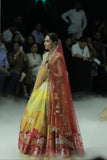 RADHA MULTICOLOUR LEHENGA PAIRED WITH A TOOSH BLOUSE, HEAVY TOOSH EMBROIDERED DUPATTA, ORANGE EMBROIDERED VEIL, AND RED NET EMBROIDERED DUPATTA. (5 PCS)