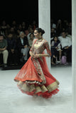 RED TULLE HEAVY EMBROIDERED ANARKALI PAIRED WITH A NUDE BUSTIER, RED BROCADE EMBROIDERED LEHENGA, AND RED TULLE EMBROIDERED DUPATTA. (4 PCS)