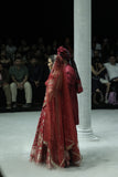 RED BROCADE DOUBLE LAYER LEHENGA PAIRED WITH A RED DUPION EMBROIDERED BLOUSE, RED EMBROIDERED DUPATTA, AND RED EMBROIDERED NET VEIL. (4 PCS)