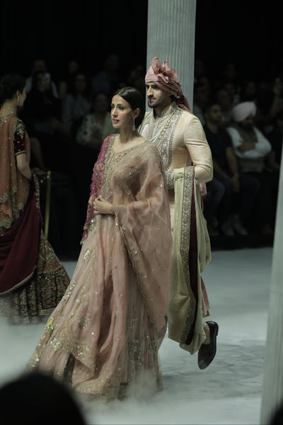 OLD ROSE NET AND ORGANZA EMBROIDERED LEHENGA SET PAIRED WITH A DELICATE FALSA EMBROIDERED DUPATTA. (4PCS)