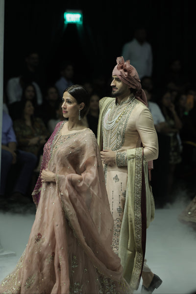 OLD ROSE NET AND ORGANZA EMBROIDERED LEHENGA SET PAIRED WITH A DELICATE FALSA EMBROIDERED DUPATTA. (4PCS)