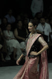 PINK CRINKLE TISSUE SAREE PAIRED WITH AN OLD ROSE TISSUE EMBROIDERED BLOUSE AND A DEEP PURPLE VELVET EMBROIDERED BLOUSE. (3 PCS)