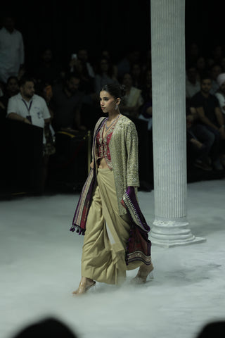 GOLD DRAPE SKIRT PAIRED WITH A RUBY EMBROIDERED KOTI, GOLD TISSUE EMBROIDERED LONG JACKET, AND PURPLE ANTIQUE DUPATTA. (4 PCS)