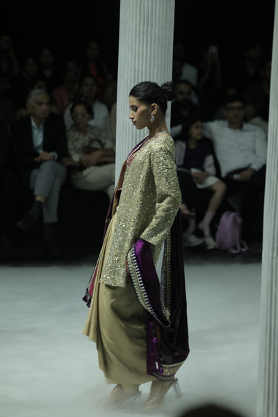 GOLD DRAPE SKIRT PAIRED WITH A RUBY EMBROIDERED KOTI, GOLD TISSUE EMBROIDERED LONG JACKET, AND PURPLE ANTIQUE DUPATTA. (4 PCS)