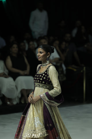 GOLD TISSUE CRUSHED ANARKALI PAIRED WITH A GREEN EMBROIDERED KOTI, SHARARA, AND PURPLE ANTIQUE EMBROIDERED DUPATTA. (4 PCS)