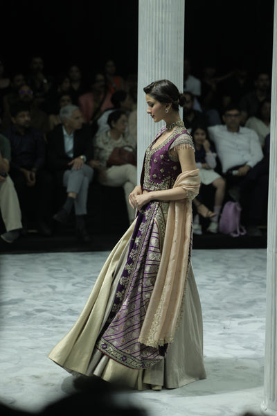 SILVER AND GOLD TISSUE SKIRT PAIRED WITH A PURPLE DUPION EMBROIDERED JACKET, OLD ROSE BLOUSE, BLUSH EMBROIDERED DUPATTA, AND PURPLE BROCADE EMBROIDERED DUPATTA. (5 PCS)