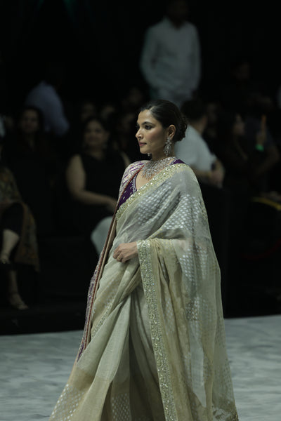 GOLD FOIL-PRINTED TISSUE SAREE PAIRED WITH A PURPLE EMBROIDERED KEDIA AND PEACH TISSUE ANTIQUE BORDER DUPATTA. (3PCS)