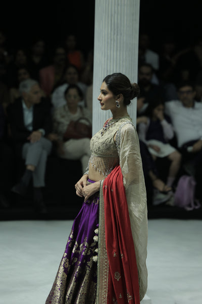 PURPLE BANARASI BROCADE LEHENGA PAIRED WITH A TOOSH EMBROIDERED BLOUSE, TOOSH EMB CRUSHED DUPATTA, AND RED EMBROIDERED DUPATTA.(4PCS)