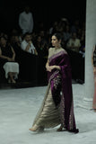 TWO-PIECE SAREE FEATURING A DEEP FALSA VELVET DUPATTA WITH TUSSAR EMBROIDERY, PAIRED WITH A TOOSH EMBROIDERED CHANDERI BLOUSE. (3PCS)