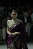 TWO-PIECE SAREE FEATURING A DEEP FALSA VELVET DUPATTA WITH TUSSAR EMBROIDERY, PAIRED WITH A TOOSH EMBROIDERED CHANDERI BLOUSE. (3PCS)