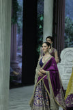 BLUE BROCADE LEHENGA PAIRED WITH A BLUE BUSTIER, PURPLE SILK DUSHALA, AND TOOSH ORGANZA EMBROIDERED DUPATTA.(4PCS)
