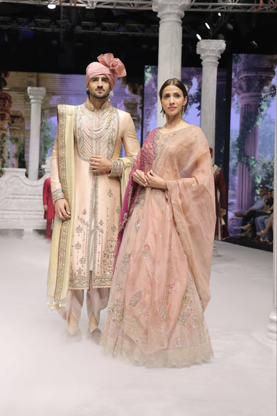 OLD ROSE NET AND ORGANZA EMBROIDERED LEHENGA SET PAIRED WITH A DELICATE FALSA EMBROIDERED DUPATTA. (4PCS)
