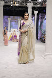 GOLD FOIL-PRINTED TISSUE SAREE PAIRED WITH A PURPLE EMBROIDERED KEDIA AND PEACH TISSUE ANTIQUE BORDER DUPATTA. (3PCS)