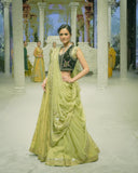 PISTACHIO GREEN EMB LEHENGA SAREE PAIRED WITH A BLACK FLORAL EMB BLOUSE AND EMBELLISHED JACKET.(4 PCS)