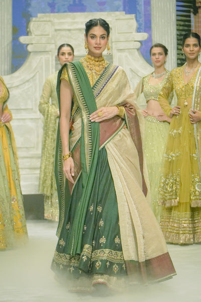 TOOSH TISSUE SAREE PAIRED WITH A GREEN DUPION EMBROIDERED LEHENGA AND MUSTARD EMBROIDERED JACKET. (4 PCS)