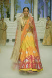 RADHA MULTICOLOUR LEHENGA PAIRED WITH A TOOSH BLOUSE, HEAVY TOOSH EMBROIDERED DUPATTA, ORANGE EMBROIDERED VEIL, AND RED NET EMBROIDERED DUPATTA. (5 PCS)