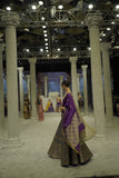 BLUE BROCADE LEHENGA PAIRED WITH A BLUE BUSTIER, PURPLE SILK DUSHALA, AND TOOSH ORGANZA EMBROIDERED DUPATTA.(4PCS)
