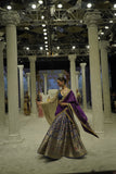 BLUE BROCADE LEHENGA PAIRED WITH A BLUE BUSTIER, PURPLE SILK DUSHALA, AND TOOSH ORGANZA EMBROIDERED DUPATTA.(4PCS)