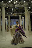BLUE BROCADE LEHENGA PAIRED WITH A BLUE BUSTIER, PURPLE SILK DUSHALA, AND TOOSH ORGANZA EMBROIDERED DUPATTA.(4PCS)