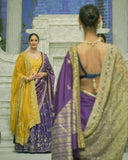 BLUE BROCADE LEHENGA PAIRED WITH A BLUE BUSTIER, PURPLE SILK DUSHALA, AND TOOSH ORGANZA EMBROIDERED DUPATTA.(4PCS)