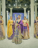 BLUE BROCADE LEHENGA PAIRED WITH A BLUE BUSTIER, PURPLE SILK DUSHALA, AND TOOSH ORGANZA EMBROIDERED DUPATTA.(4PCS)
