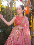 BLUSH PINK FLORAL LEHENGA PAIRED WITH AN EMBROIDERED CORAL BLOUSE AND A SHEER SCALLOPED DUPATTA. (3PCS)