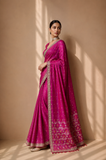 A BRIGHT PINK SAREE WITH SMALL GOLD MOTIFS AND AN EMBROIDERED BORDER. (2PCS)