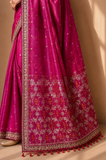 A BRIGHT PINK SAREE WITH SMALL GOLD MOTIFS AND AN EMBROIDERED BORDER. (2PCS)