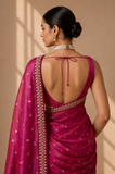 A BRIGHT PINK SAREE WITH SMALL GOLD MOTIFS AND AN EMBROIDERED BORDER. (2PCS)