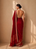 A DEEP RED SAREE FINISHED WITH GOLD BORDER DETAILS. (2PCS)