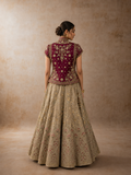 A RUBY EMBROIDERED JACKET PAIRED WITH A SOFT TOOSH LEHENGA. (2 PCS)