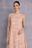 A SOFT PEACH SLEEVELESS DRESS DEFINED BY FLUID MOVEMENTAND SUBTLE GRACE